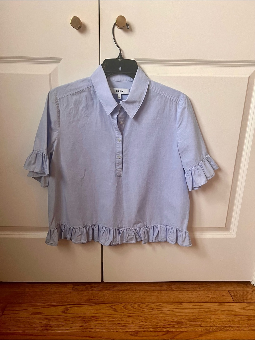 Light Blue Button-Front Collared Shirt with ruffle sleeve and hem